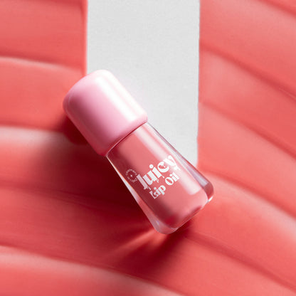 Gush Beauty Balmy Glossy Tinted Lip Oil in Baby Pink, showing a smooth, shiny lip gloss applied on lips with a soft pink tint.