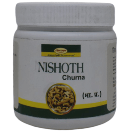 Seva Sadan Nishoth Churna, an Ayurvedic herbal powder in a bowl with dried herbs and leaves on a wooden surface.