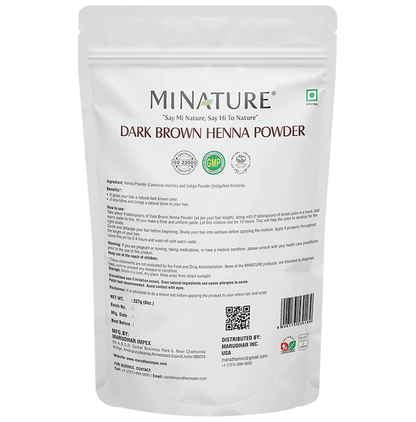 Miniature dark brown henna powder for hair masks, shown in a close-up image with a scoop and powder in a bowl.