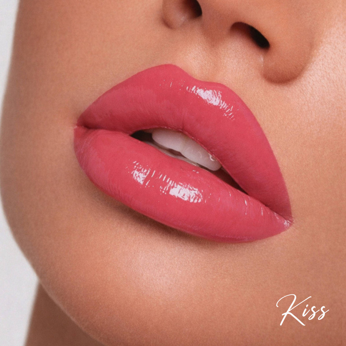 Parul Garg Beauty high shine nourishing tinted lip gloss with SPF 20 in a natural pink shade, displayed on a neutral background.