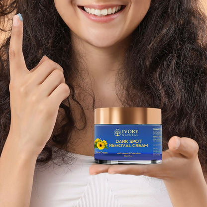 Ivory Natural dark spot removal face cream in a jar, showing the creamy texture and light ivory color for glowing skin.