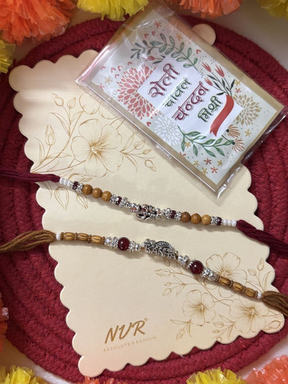 Anouk Set Of 2 Silver Toned Religious Rakhi Thread Rakhi Roli Chawal Chandan Mishri