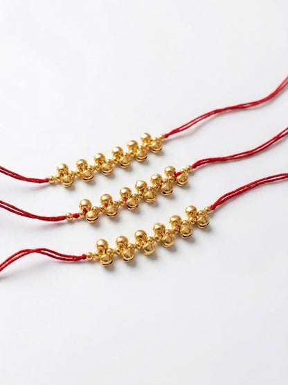Anouk Set Of 3 Gold Toned Ghungroo & Red Thread Rakhi With Roli Chawal Chandan Mishri