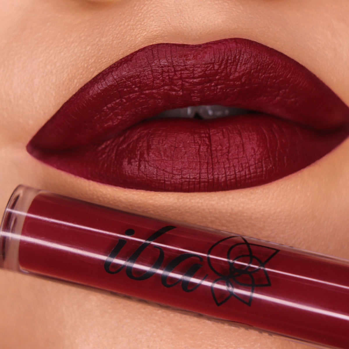 Iba Maxx Matte Liquid Lipstick in Burgundy Blush, showing the sleek tube and applicator with the rich, matte lipstick inside.