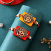 Dhiyona Gold Toned Set Of 2 Om Charm Thread Rakhis With Roli Chawal & Greeting Card