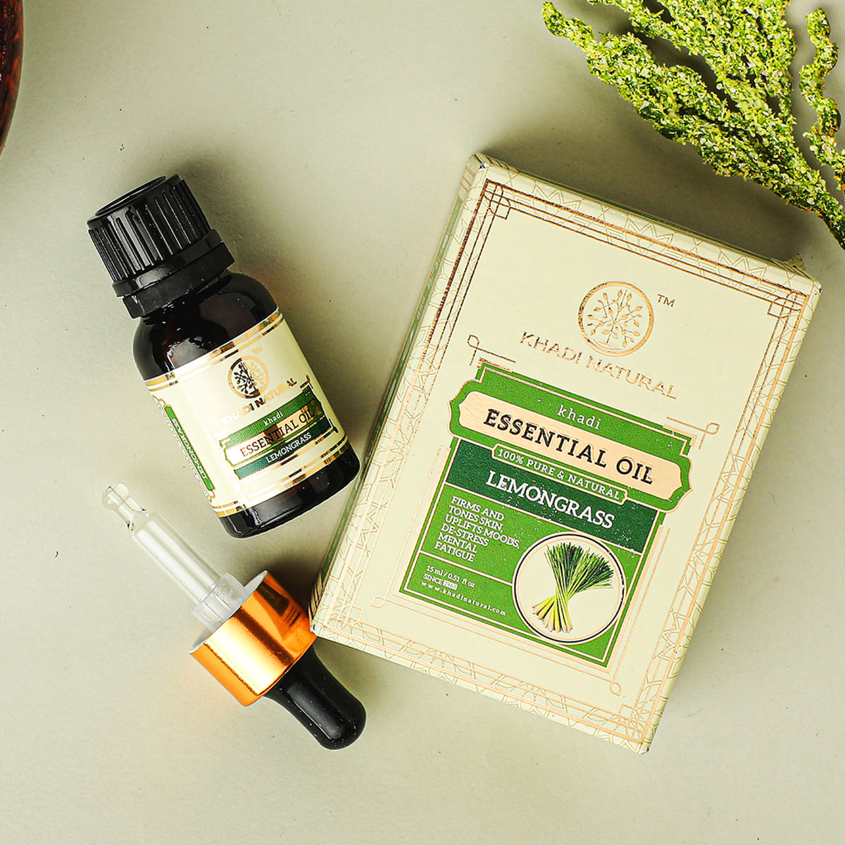 Khadi Natural Lemongrass Essential Oil bottle with dropper, used to firm and tone skin, natural skincare product.