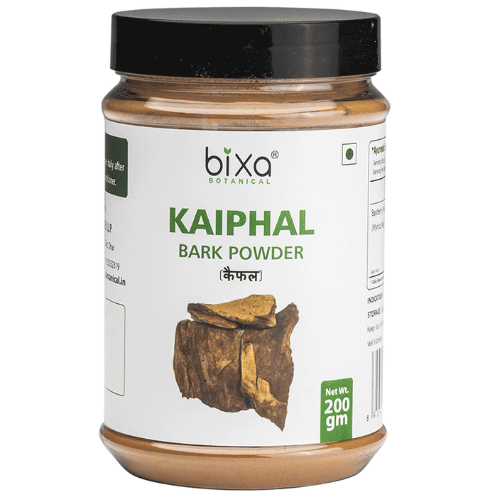 Bixa Botanical Kaiphal Powder in a glass jar, showing the light brown Ayurvedic powder with a scoop beside it.
