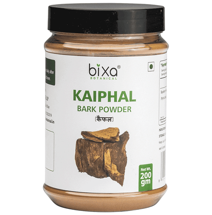Bixa Botanical Kaiphal Powder in a glass jar, showing the light brown Ayurvedic powder with a scoop beside it.