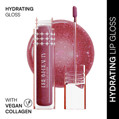 Dream Beauty Solace Lip Gloss in Selene shade, glossy lip product with smooth finish and vibrant color, shown on a model's lips.