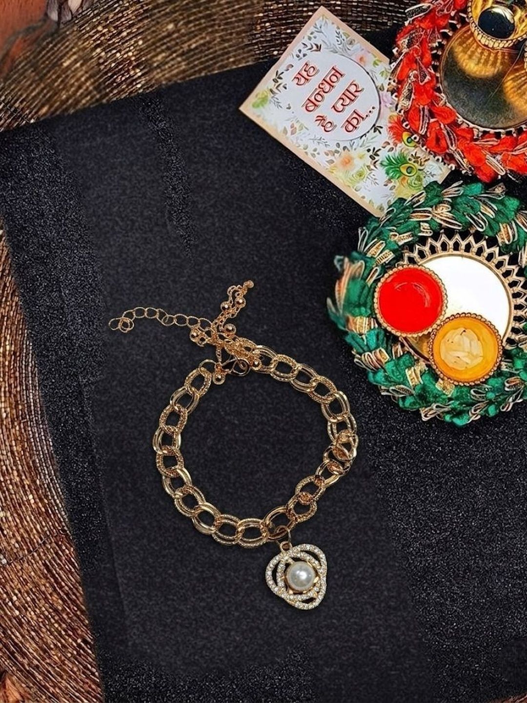 Anouk Women Gold Plated Ad Bracelet Rakhi With Roli Chawal Chandan Mishri