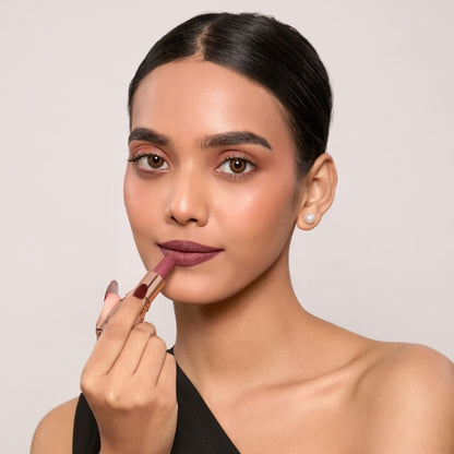 Europe Girl Spice Silky Matte Lipstick EG-10, showing a smooth, rich cinnamon-colored lipstick in a sleek tube.