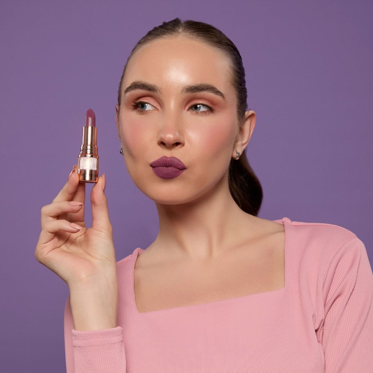 Europe Girl Silky Matte Lipstick in EG-02 Purple Petal, showcasing the deep purple shade and sleek tube design.