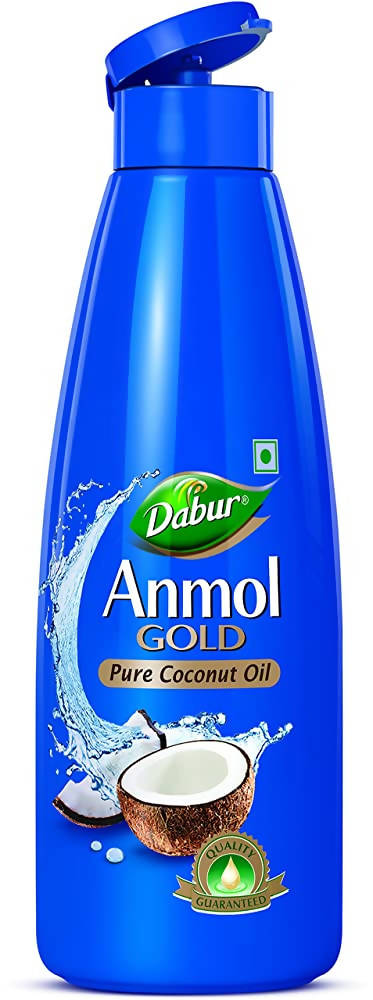 Dabur Anmol Gold Pure Coconut Oil in a clear bottle, showing golden oil ideal for hair care and natural beauty routines.