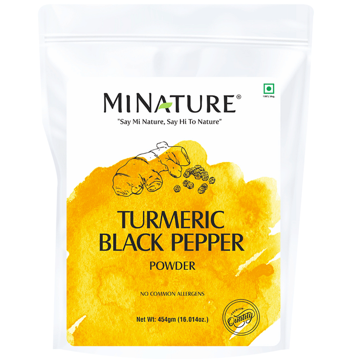 Organic Minature Ayurvedic powder with miniature turmeric and black pepper, showcasing the vibrant yellow and black spices.