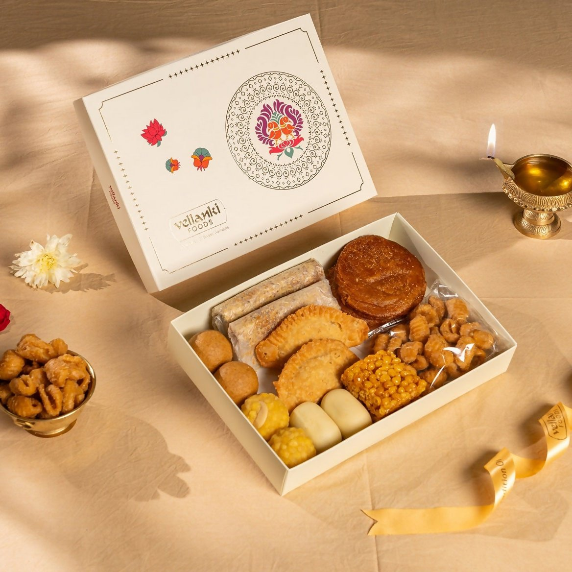 Assorted North Indian sweets in a Vellanki Foods Traditional Sweet Box, showing colorful traditional Indian desserts.