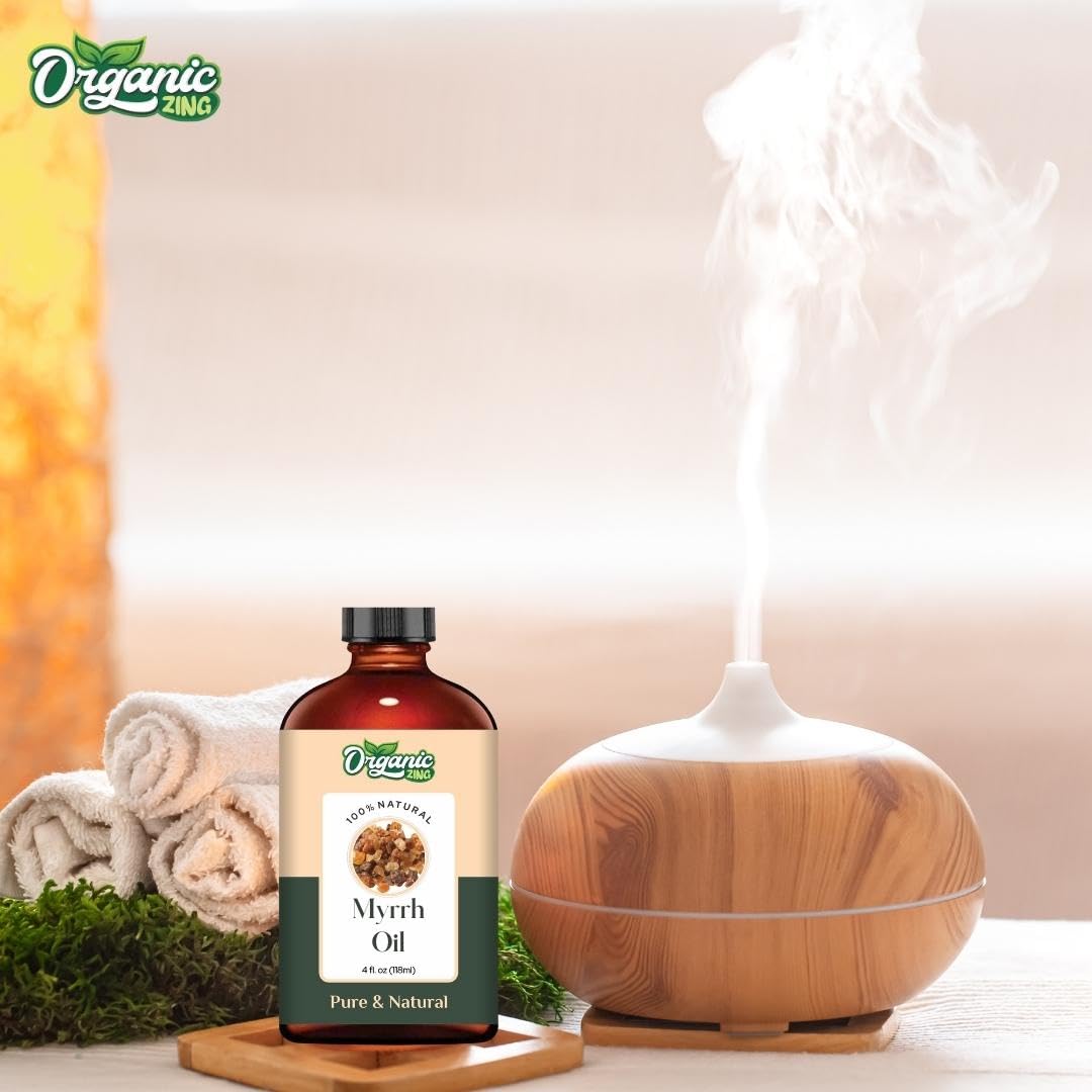 Organic Zing Myrrh oil bottle for aroma, skincare, and massage, showcasing a clear glass container with a black cap.
