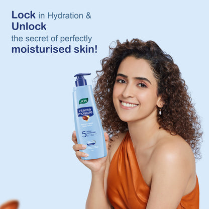 Joy Intense Moisture Dryness Repair Body Lotion with Vitamin E and Jojoba, providing 24-hour softness for winter skin.
