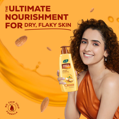Joy Honey & Almonds nourishing body lotion bottle with shea butter and vitamin E, designed for winter skin hydration.