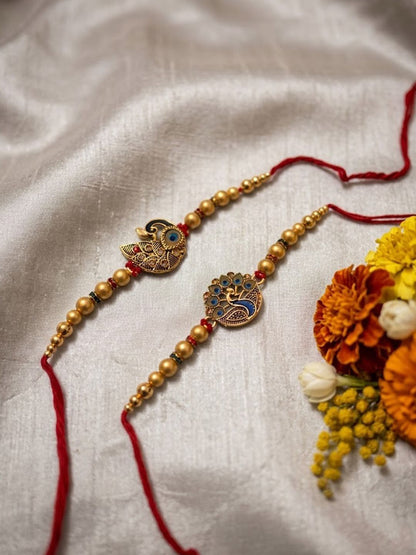 Anouk Set Of 2 Peacock & Ghungroo Design Multicolor Thread Rakhi With Roli Chawal Chandan