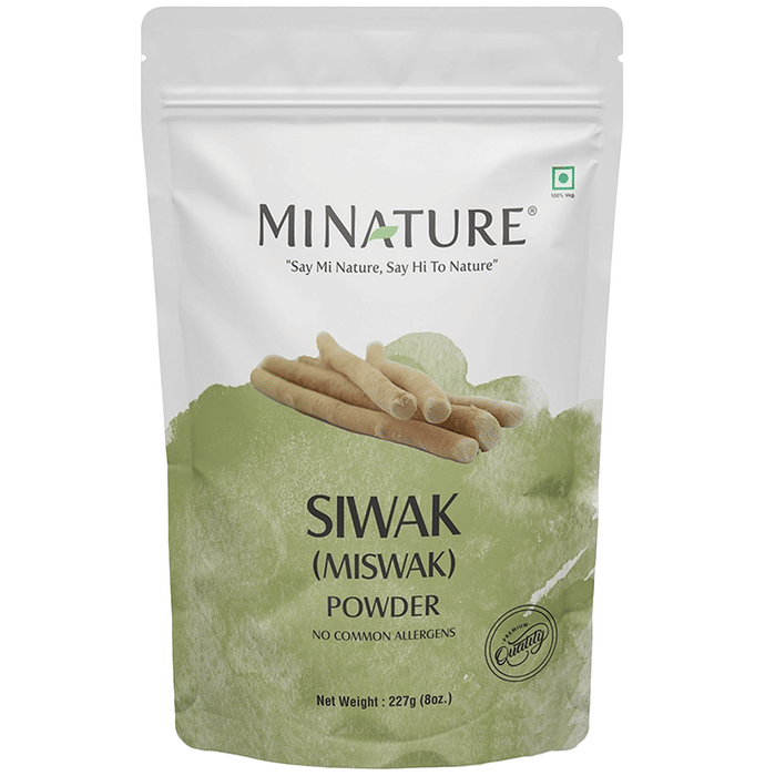 Miniature Miswak tooth powder in a jar, natural herbal dental product for oral hygiene, from Minature brand.