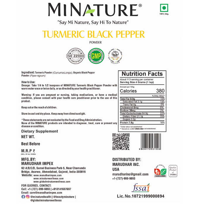 Minature organic turmeric and black pepper Ayurvedic powder in a small jar, highlighting vibrant turmeric and black pepper particles.
