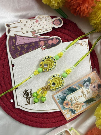 Anouk Set Of 2 Artificial Beads Mirror Work Bhaiya Bhabhi Rakhi With Roli Chawal Chandan