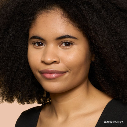 Bobbi Brown Weightless Skin Natural Matte Finish Foundation SPF 15 in Warm Honey, showcasing the foundation bottle with applicator.