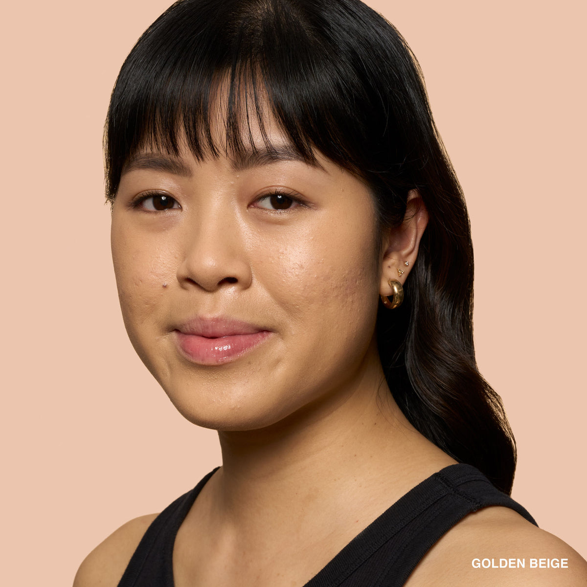 Bobbi Brown Weightless Skin Natural Matte Finish Foundation SPF 15 in Golden Beige, with a smooth, lightweight liquid foundation bottle.