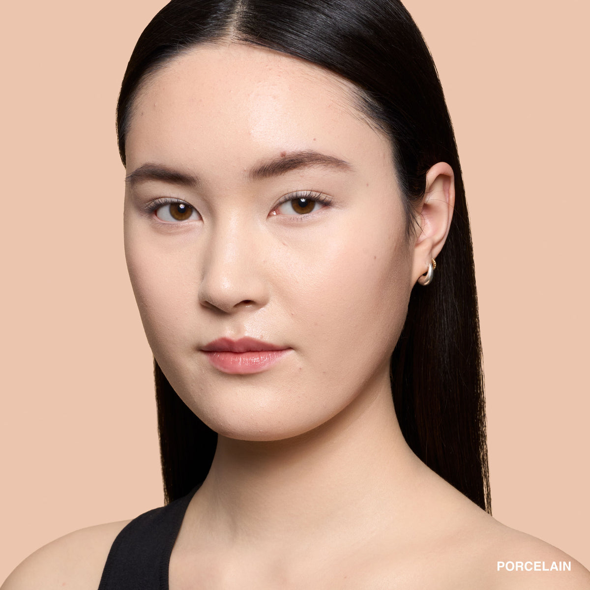 Bobbi Brown Mini Weightless Skin Foundation in Porcelain with natural matte finish and SPF 15, shown in the image.