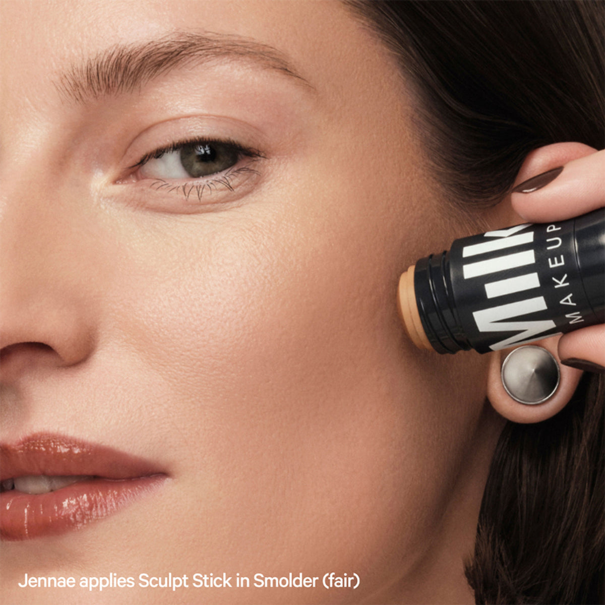 MILK MAKEUP Sculpt Stick in Smolder, a cream contour stick with a warm brown shade, displayed on a neutral background.