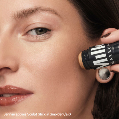 MILK MAKEUP Sculpt Stick in Smolder, a cream contour stick with a warm brown shade, displayed on a neutral background.