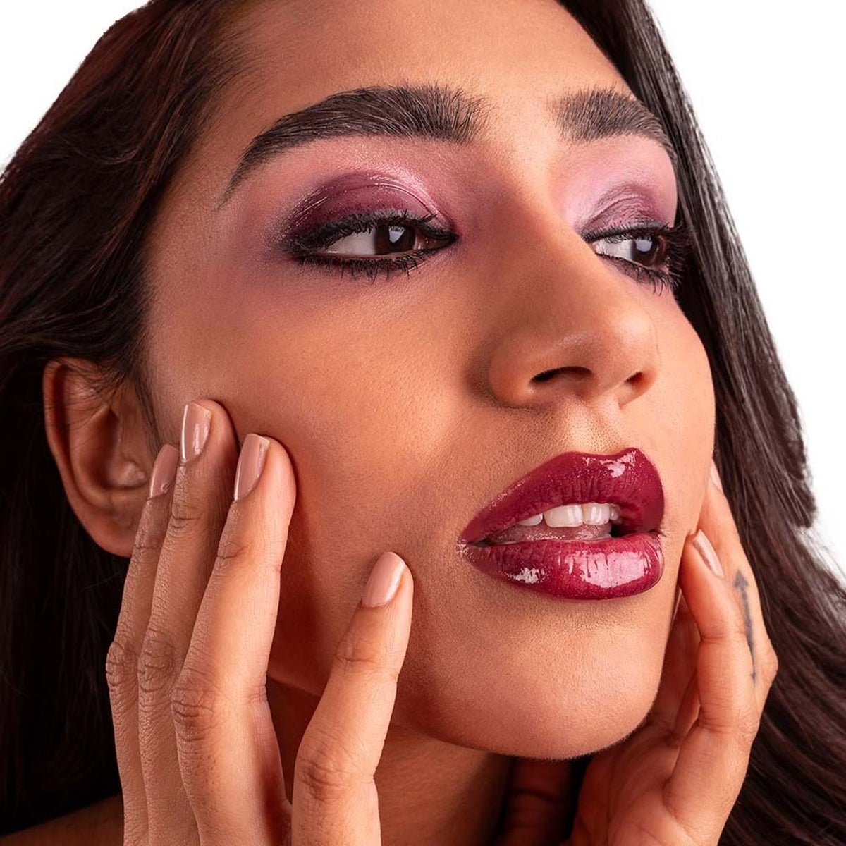 KIRO Rizz Lip Gloss in shade 01 Pop My Berry, featuring a glossy, vibrant berry-colored lip gloss tube.