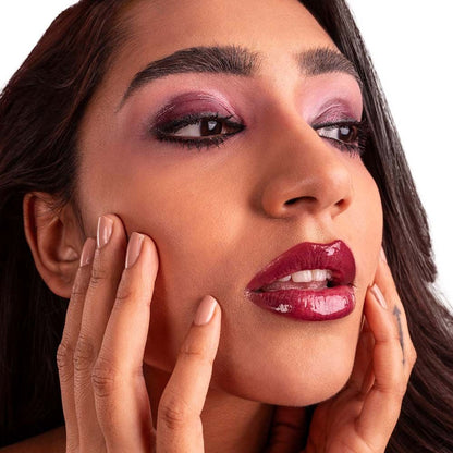 KIRO Rizz Lip Gloss in shade 01 Pop My Berry, featuring a glossy, vibrant berry-colored lip gloss tube.