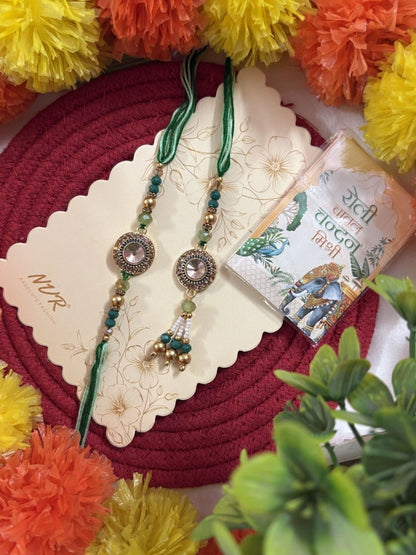 Anouk Set Of 2 Ad Drawstring Bhaiya Bhabhi Rakhi With Roli Chawal Chandan Mishri