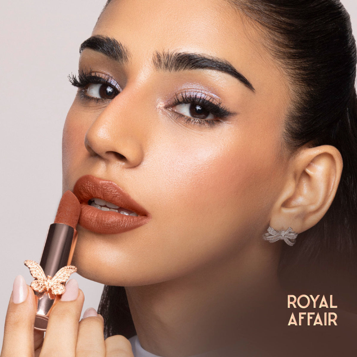 Nykaa Cosmetics Bridgerton Creamy Matte Longwear Lipstick in Royal Affair, deep red shade, with sleek packaging and creamy texture
