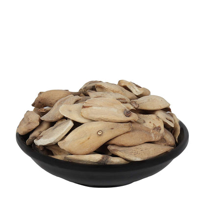 Yuvika Suranjaan Mithi Ayurvedic sweet made from Colchicum Luleum, displayed in a bowl with traditional packaging in the background.