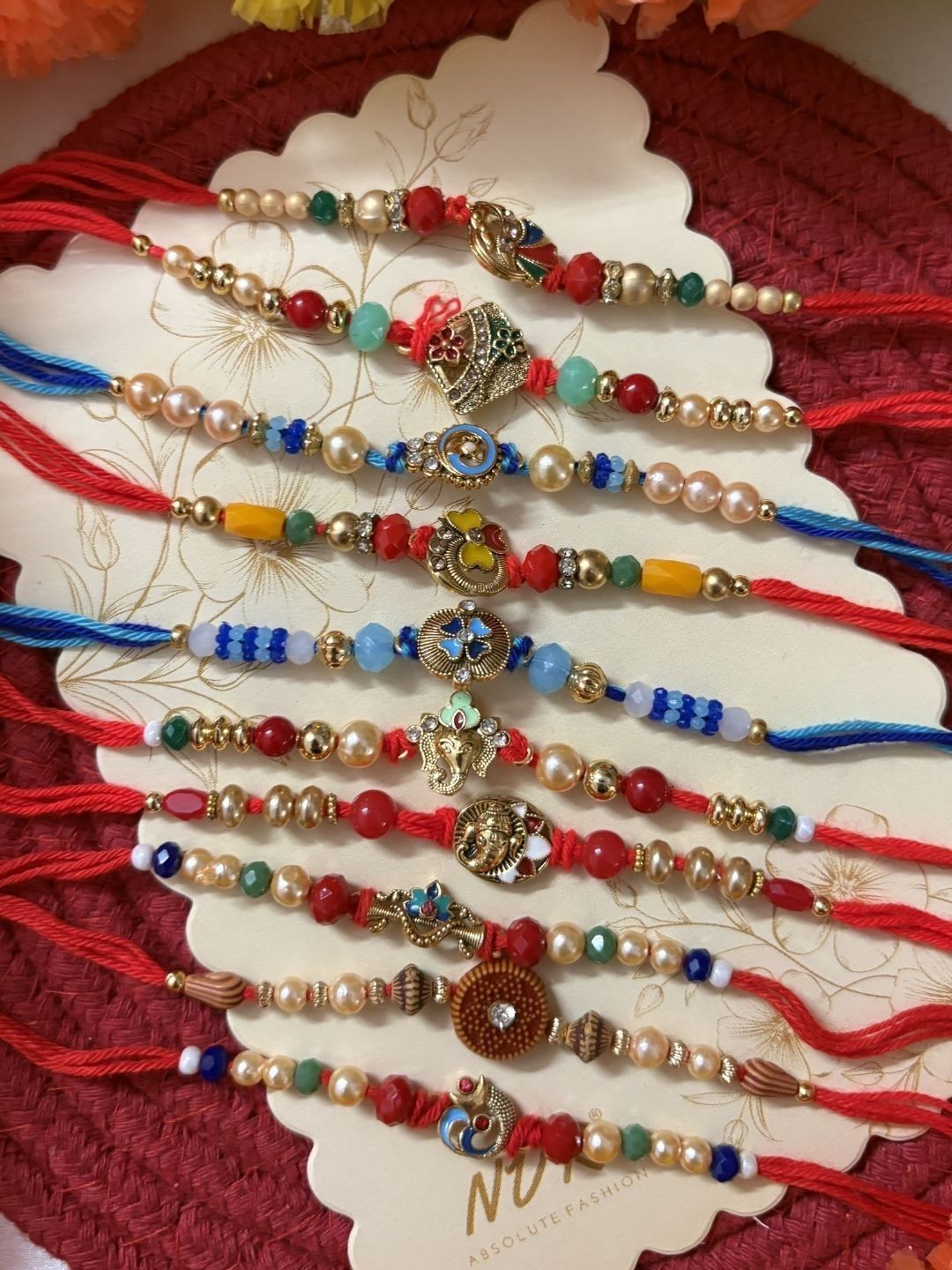 Anouk Set Of 10 Artificial Stones & Beads Thread Rakhi With Roli Chawal Chandan Mishri