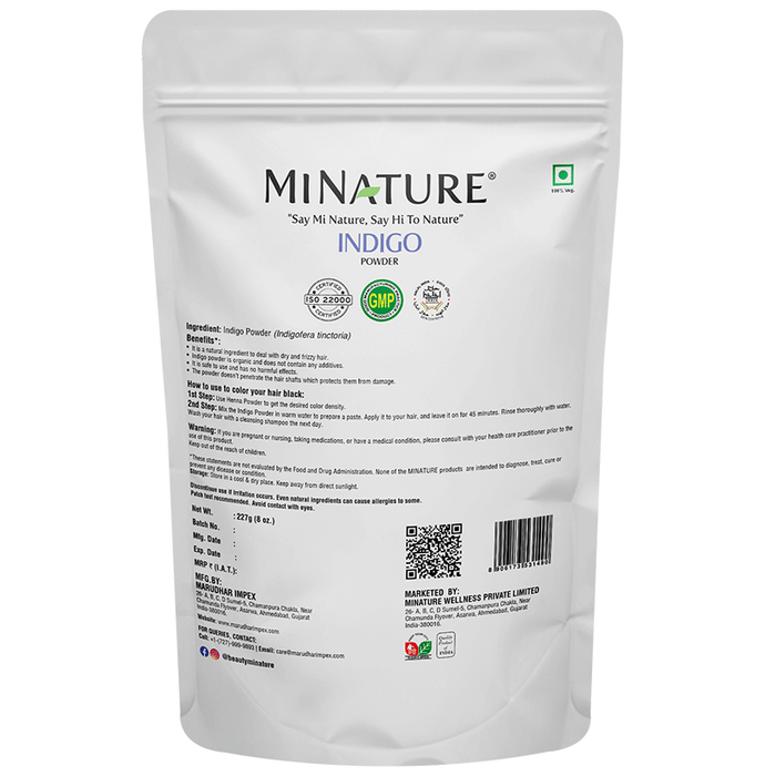 Miniature organic indigo powder for hair masks in a small container, showcasing vibrant blue indigo powder.