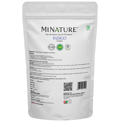 Miniature organic indigo powder for hair masks in a small container, showcasing vibrant blue indigo powder.