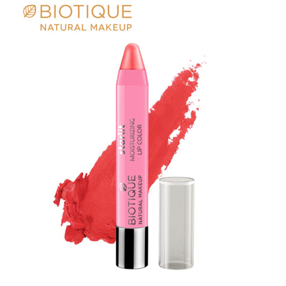 Biotique Starlit Moisturising Lipcolor in Coral Dew, a vibrant coral shade, showcasing the lipstick tube with the color swatched on lips.