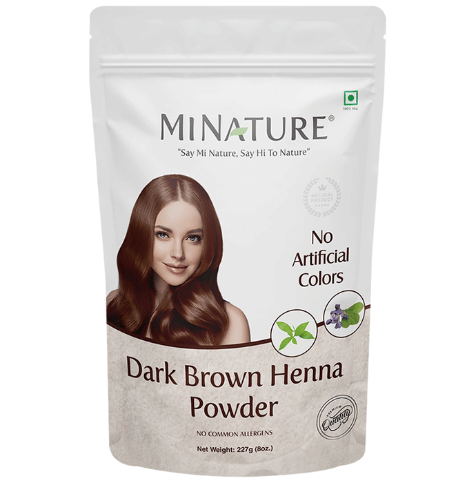 Miniature dark brown henna powder for hair masks, finely sifted and in a small container, ideal for natural hair coloring and conditioning.