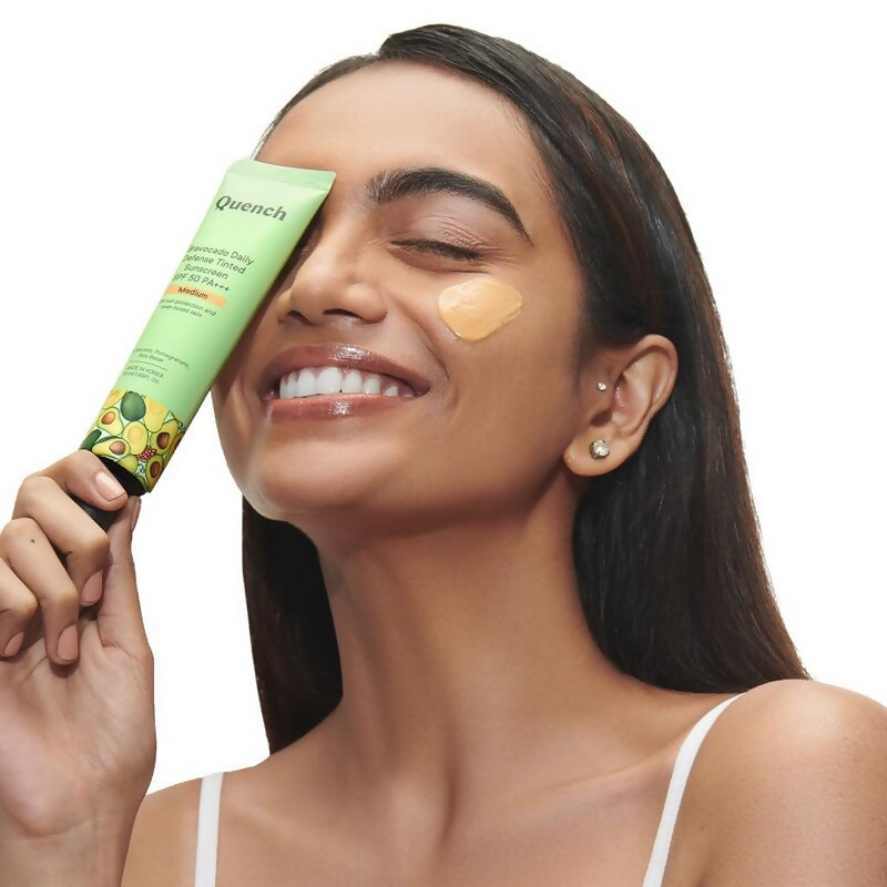 Quench Vitamin E Tinted SPF 50 Sunscreen with mineral and chemical actives, medium shade, providing sun protection and a tinted finish.