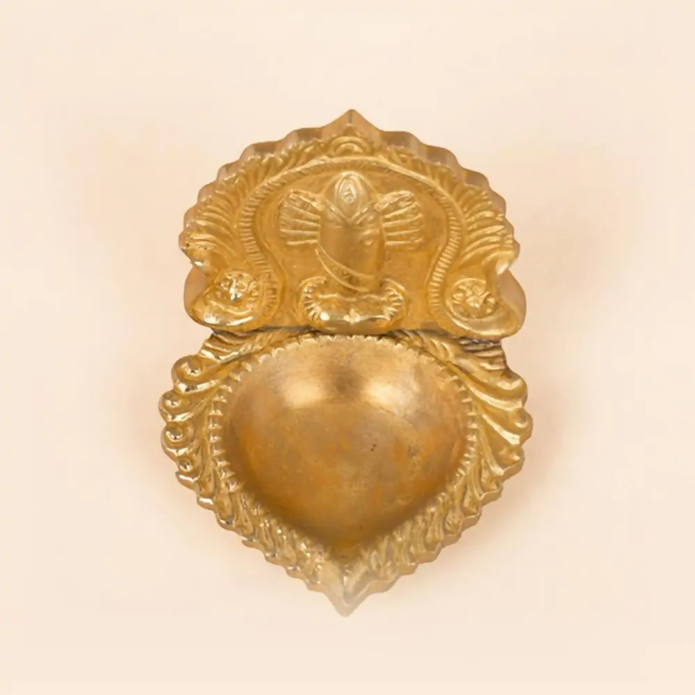 Brass Linga Bhairavi idol lamp from Isha Life, featuring detailed craftsmanship and traditional Hindu deity design.