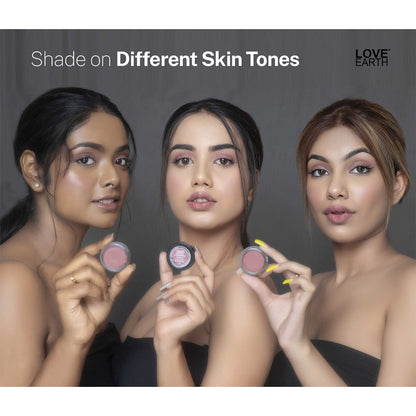 Love Earth Kiss and Tell multipot lip and cheek tint in a compact container, showing the product's natural, rosy shade.