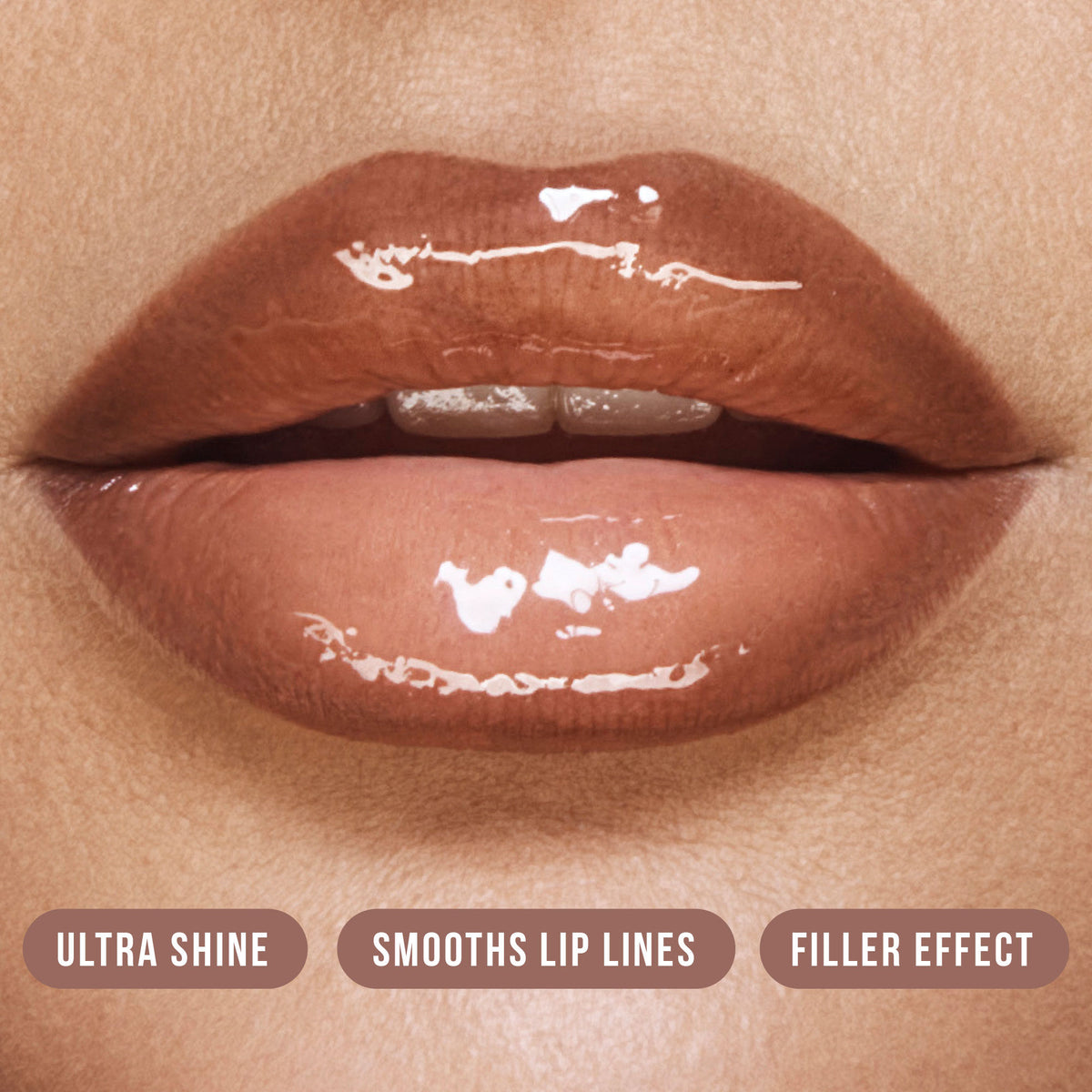 Huda Beauty Faux Filler Extra Shine Lip Gloss in Foxy, clear gloss with a shiny finish, displayed on a neutral background.