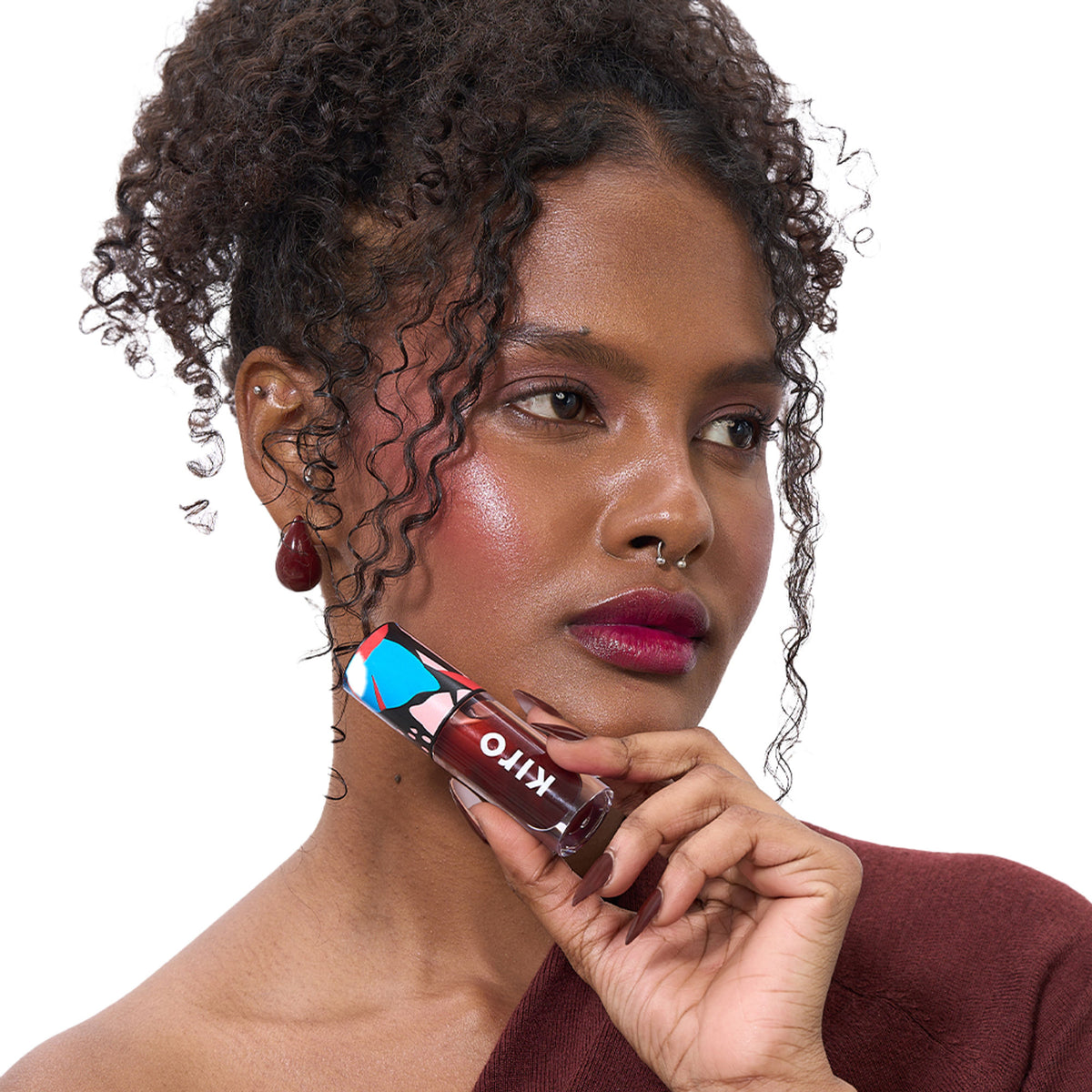 KIRO Ph Play Lip & Cheek Oil in Truffle Drip, featuring a sleek bottle with applicator for natural glow and hydration.