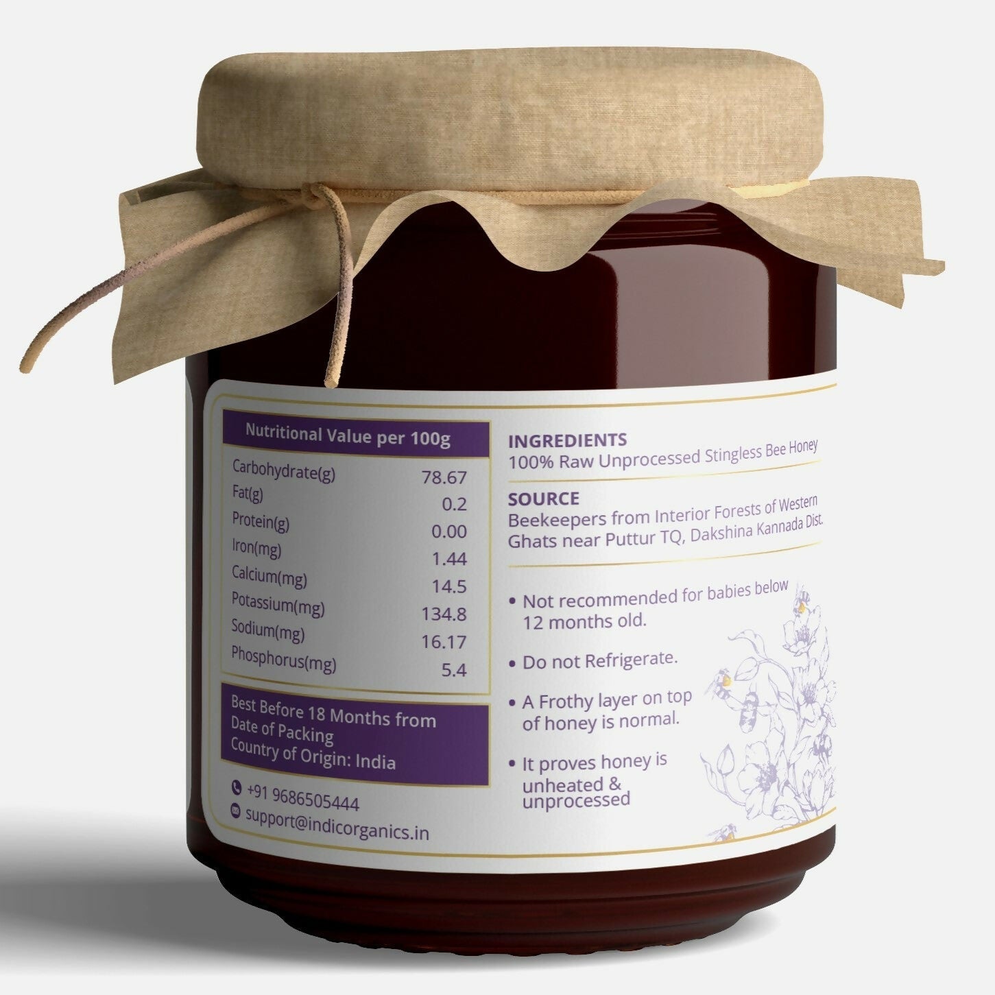 Small jar of Indic Organics Stingless Bee Raw Honey from Western Ghats, showcasing natural honey with a golden hue.