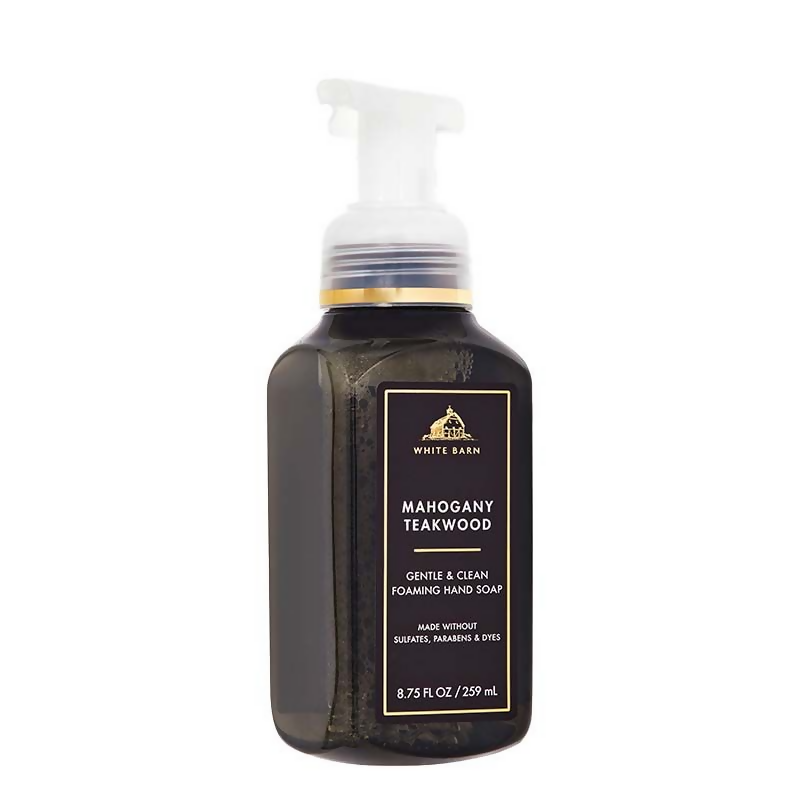 Bath & Body Works Mahogany Teakwood foaming hand wash bottle with elegant label and pump dispenser.