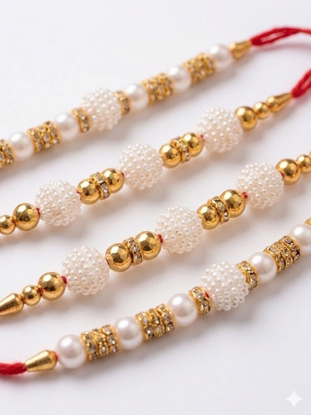 Anouk Set Of 4 White Pearls & Red Thread Rakhi With Roli Chawal Chandan Mishri