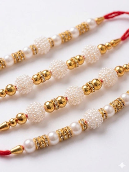 Anouk Set Of 4 White Pearls & Red Thread Rakhi With Roli Chawal Chandan Mishri